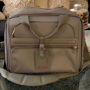 Tumi carry on bag.
